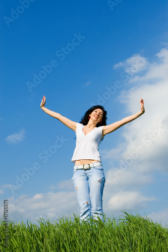 happy young woman dreams to fly on winds