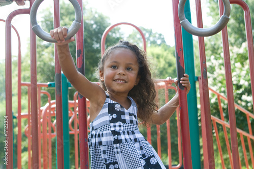 A beautiful mixed race child enjoying the playground
