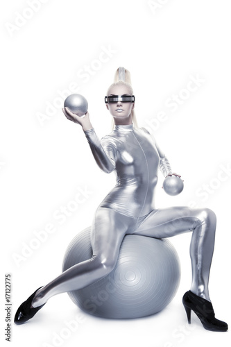 Beautiful cyber woman sitting on a silver ball ....