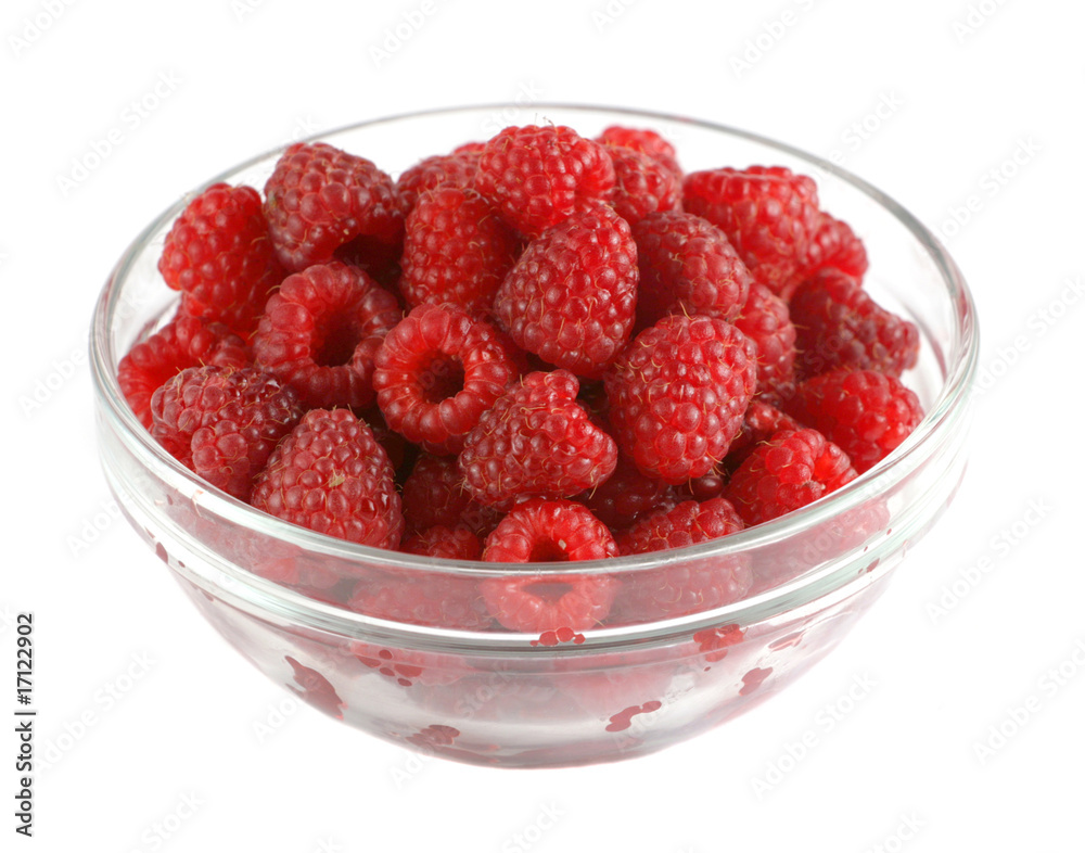 Ripe raspberries in a glass bowl isolated on white Ripe raspberries in a glass bowl isolated on white