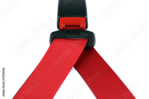 Red seat belt clasped on the lock