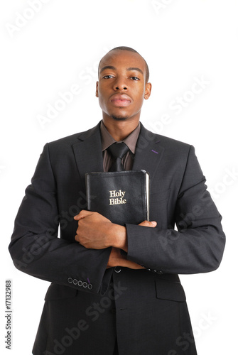 Man holding a bible showing commitment