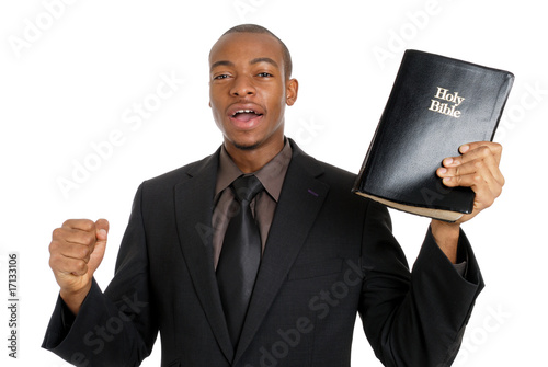 Man holding a bible preaching the gospel