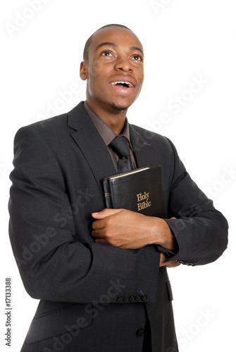 Man holding a bible showing commitment
