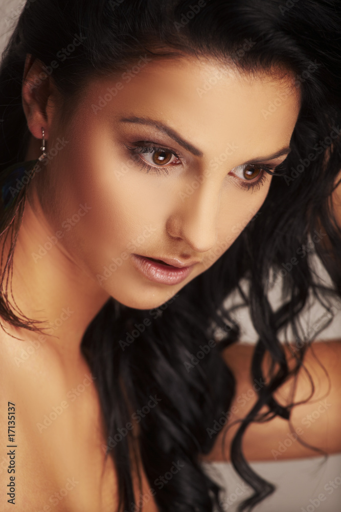 beautiful brunett model in studio on light background