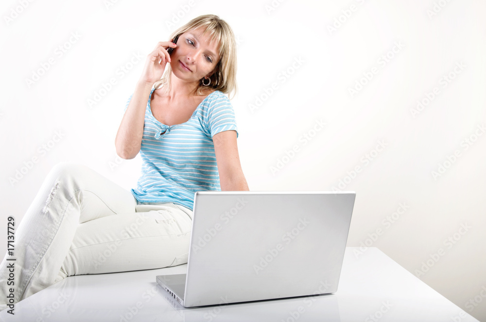 Fototapeta premium woman with phone and notebook on table, white background