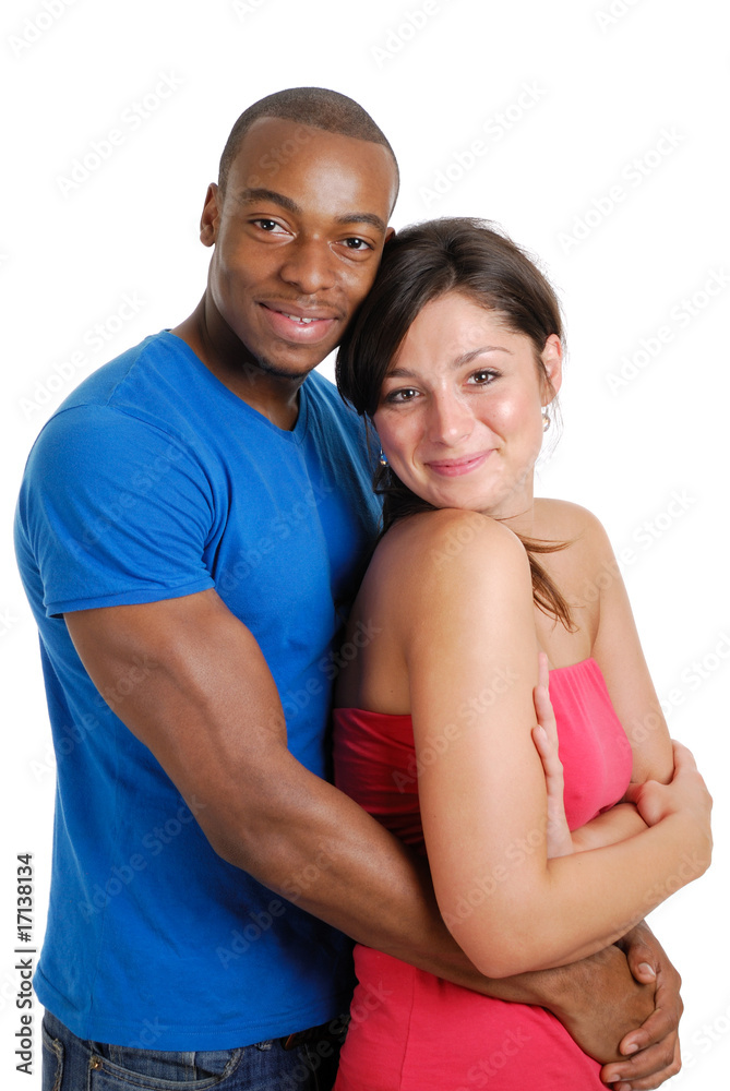 Young couple clutching each other happily Young couple clutching each other happily