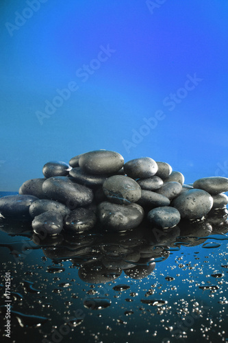 Wet zen river stones on a moonlight like background