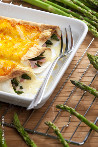 baked tortillas with green asparagus and ham photo
