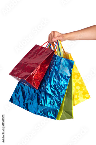 female hand holding colered bags