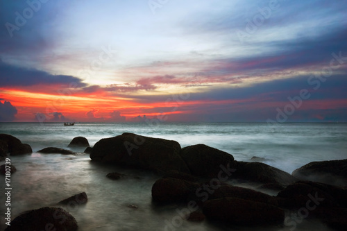 Tropical sunset on the rocks