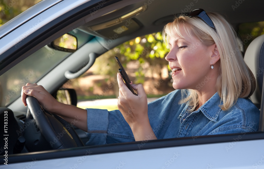 Woman Text Messaging While Driving Woman Text Messaging While Driving