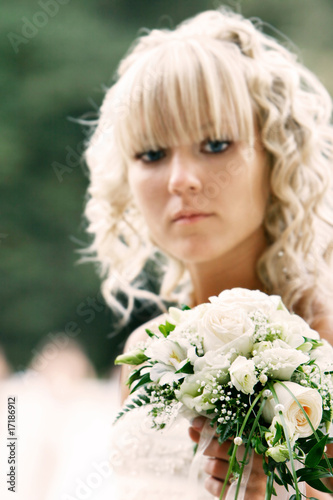 portrait of young bride with wedding bouquet