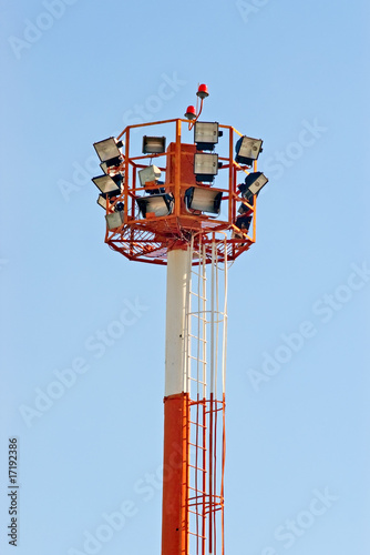 Airfield landing floodlight tower against blue sky