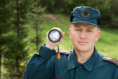rescuer with flashlight