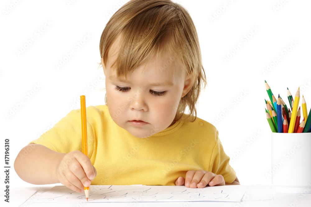 Preschooler focused on her drawing Preschooler focused on her drawing