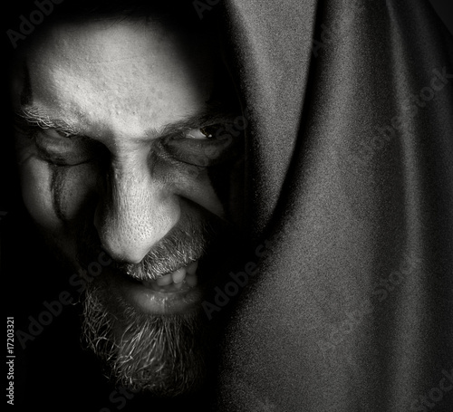 Obraz na plátne Face of evil sinister man with malefic smile