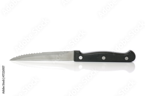 Steak knife on white