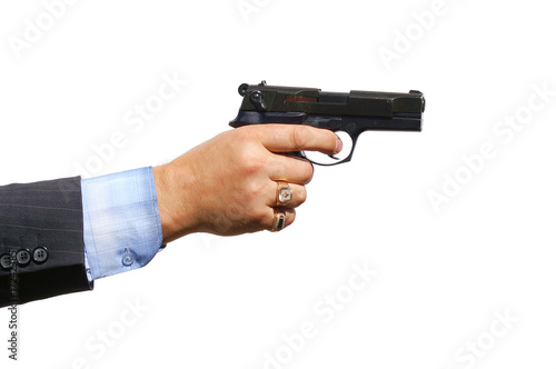 a male hand holding a gun