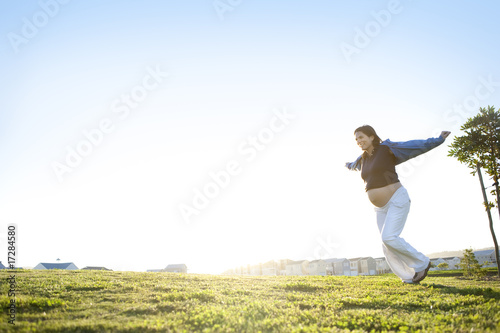 Portrait of beautiful pregnant young mature woman