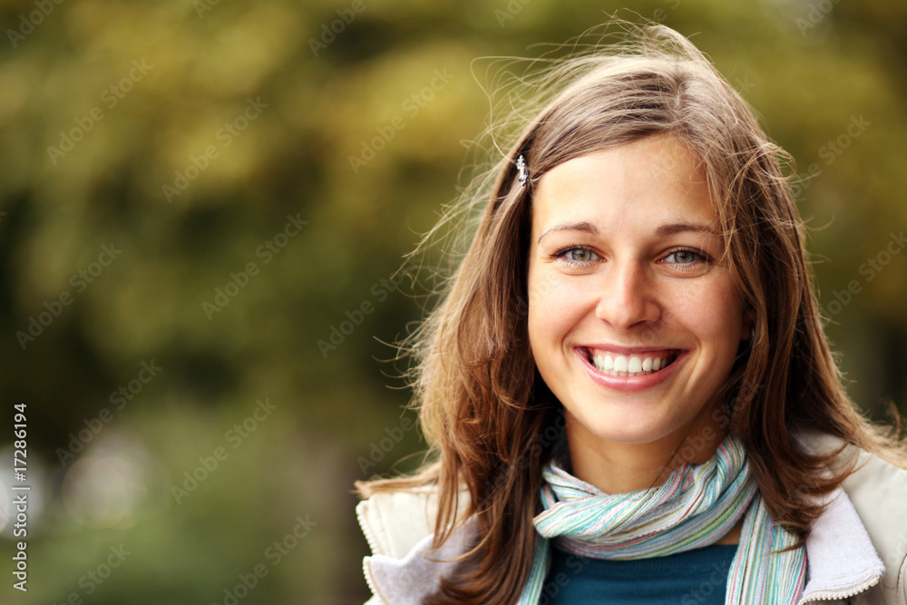 Closeup portrait of a happy young woman smiling