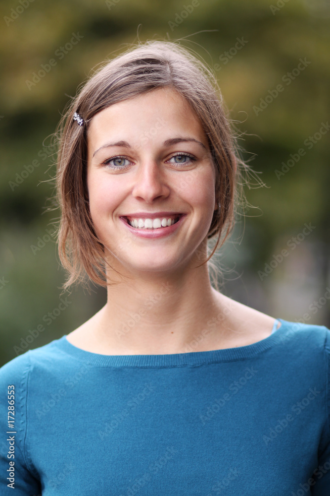 Closeup portrait of a happy young woman smiling Closeup portrait of a happy young woman smiling