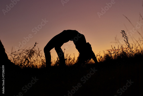 silhouette of young woman training © Yury Bege