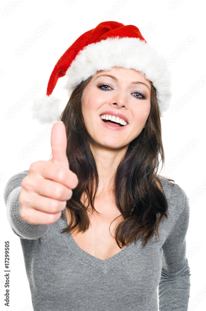 Frau mit Weihnachtsmütze macht Top Daumen