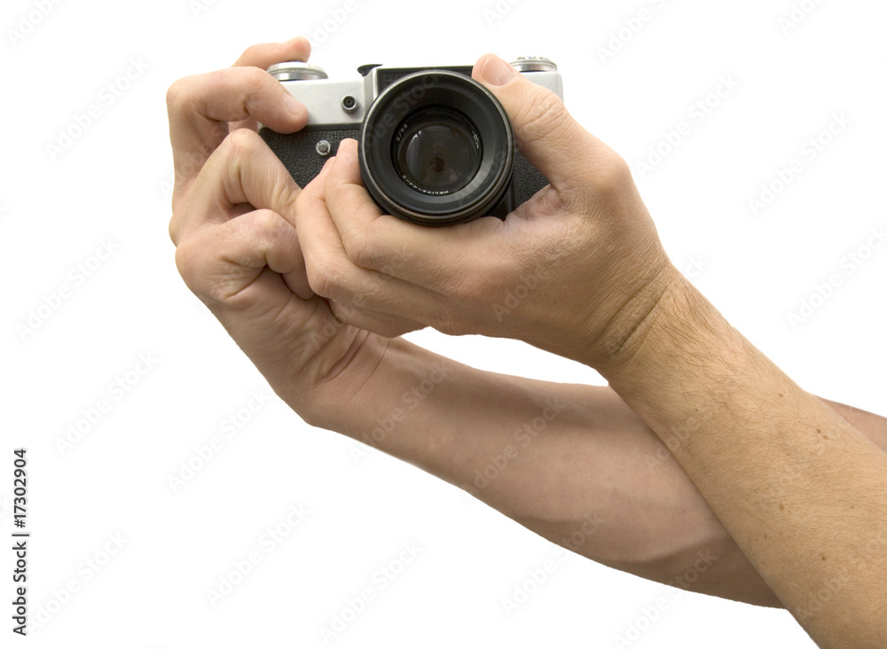 Photo camera in hands isolated on white background Photo camera in hands isolated on white background