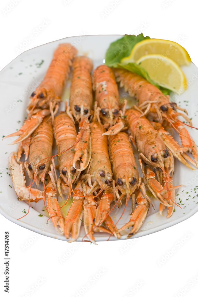 Big plate of cooked langouste facing the camera. Close view. Big plate of cooked langouste facing the camera. Close view.