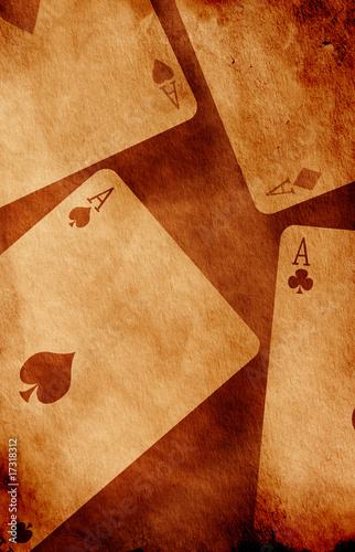 Four aces with old textured paper background