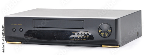 Old video cassette recorder on the white. Front side.