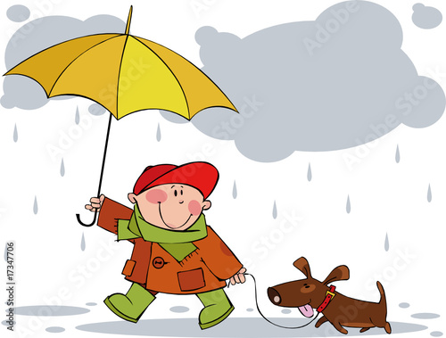 Little boy and a dog walking in the rain