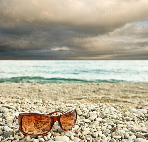 sun glasses on a seashore