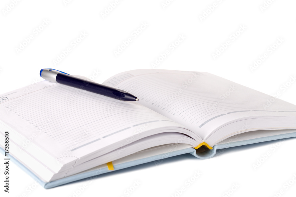 Day planner and pen isolated on white Day planner and pen isolated on white