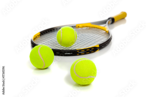 Tennis raquet with yellow balls on white © Michael Flippo