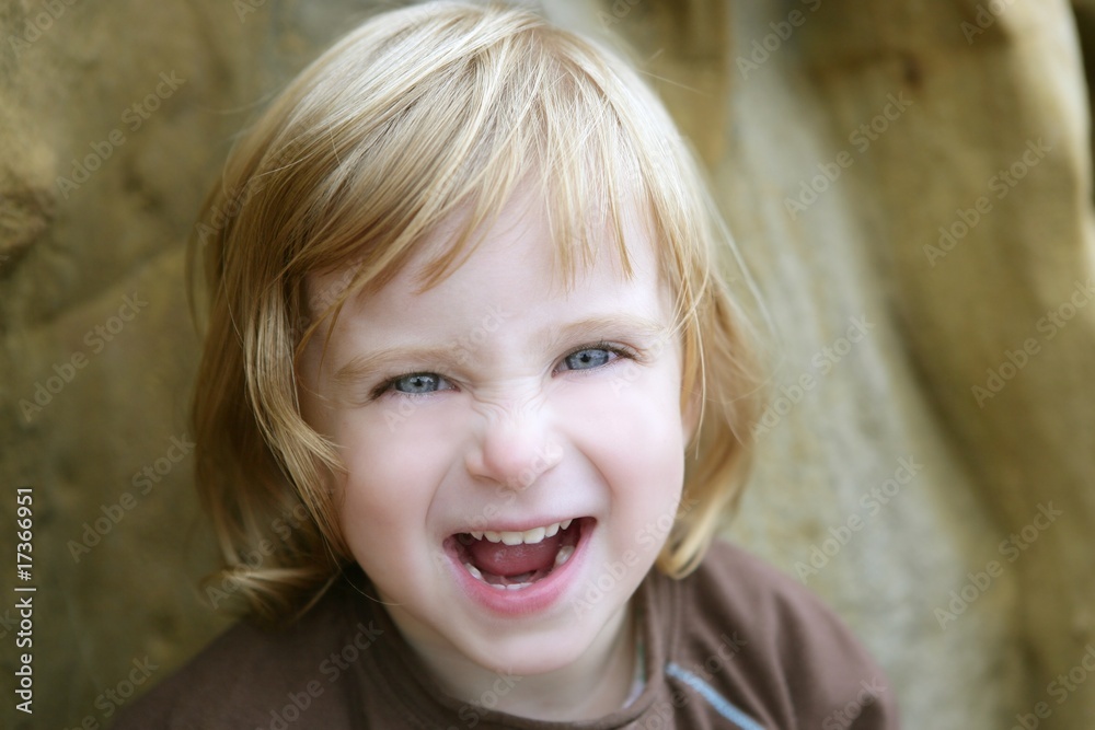 Blond little toddler girl with funny gesture Blond little toddler girl with funny gesture