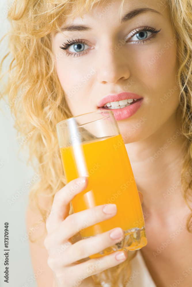 Happy young woman with juice of tropical fruit Happy young woman with juice of tropical fruit