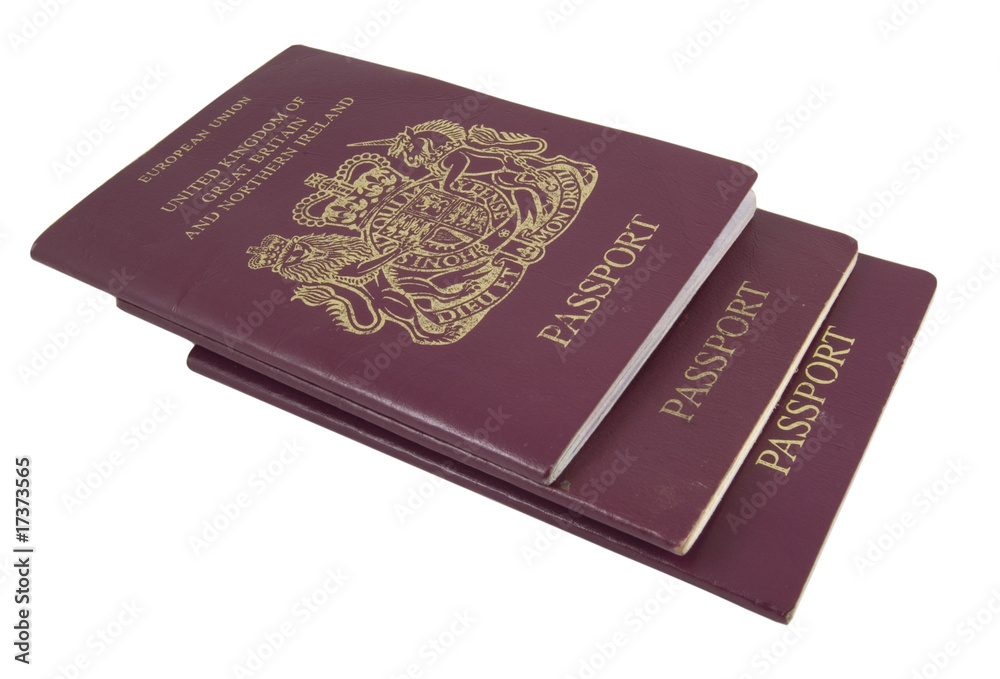 three british passports isolated on white background three british passports isolated on white background