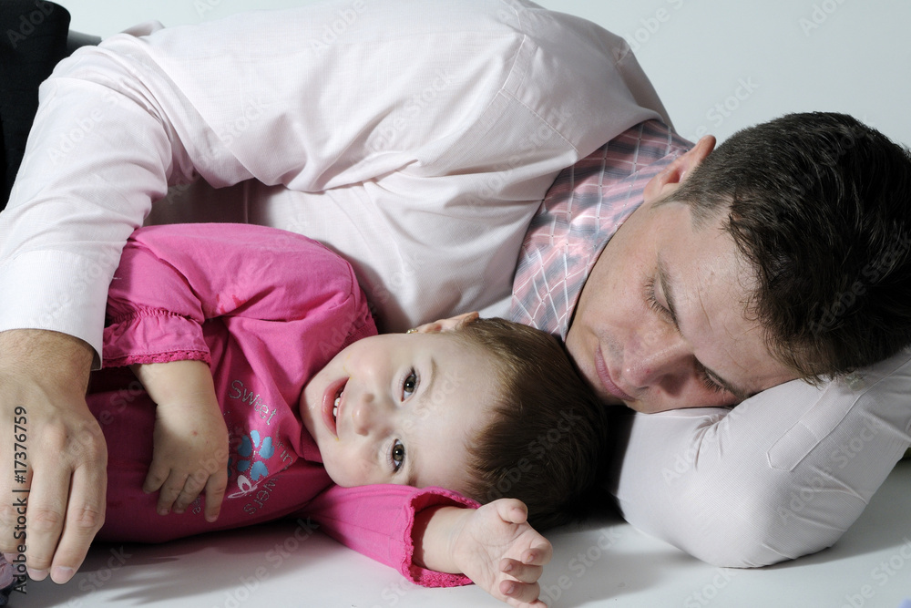 tired businessman with his daughter tired businessman with his daughter