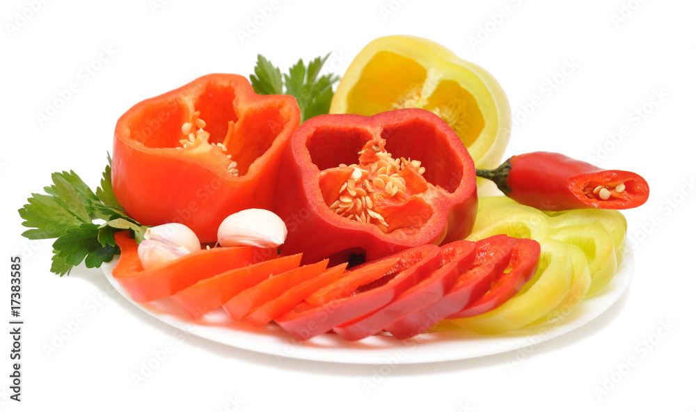 Red, yellow, orange peppers on a plate Red, yellow, orange peppers on a plate