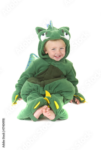 Trick or treating toddler wearing dragon costume photo