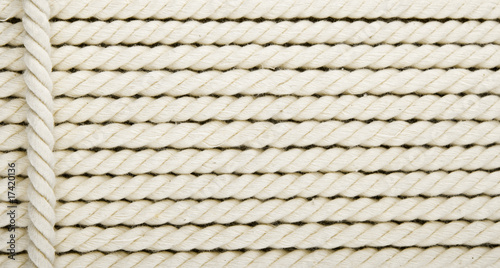 Heavy, white coiled rope.