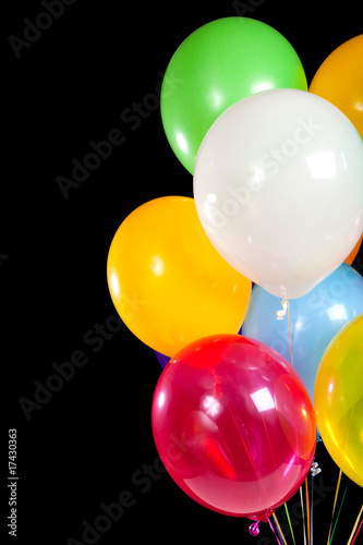 Assorted balloons on a black background