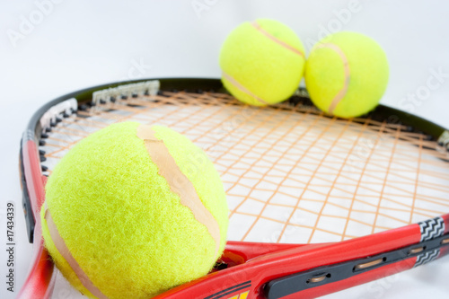 3 tennis ball on racket on white © Alexandr Makarov
