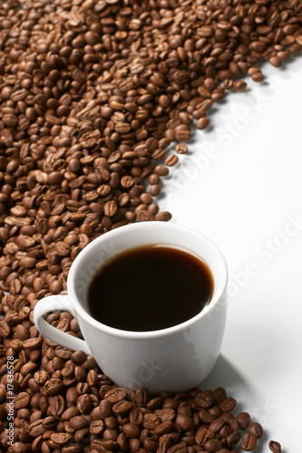 Cup with coffee  costing on coffee grain