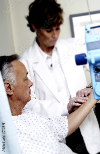 Doctor checking patients pulse