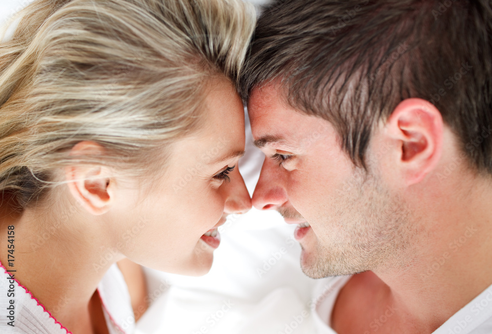 Close-up of smiling couple looking at each other Close-up of smiling couple looking at each other