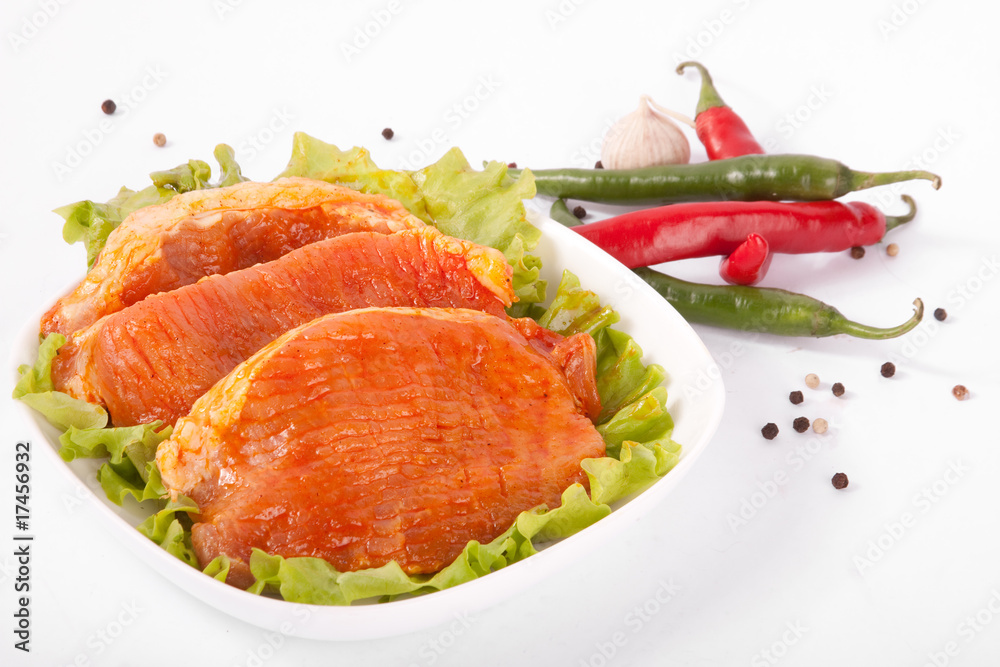 Meat in marinade with pepper