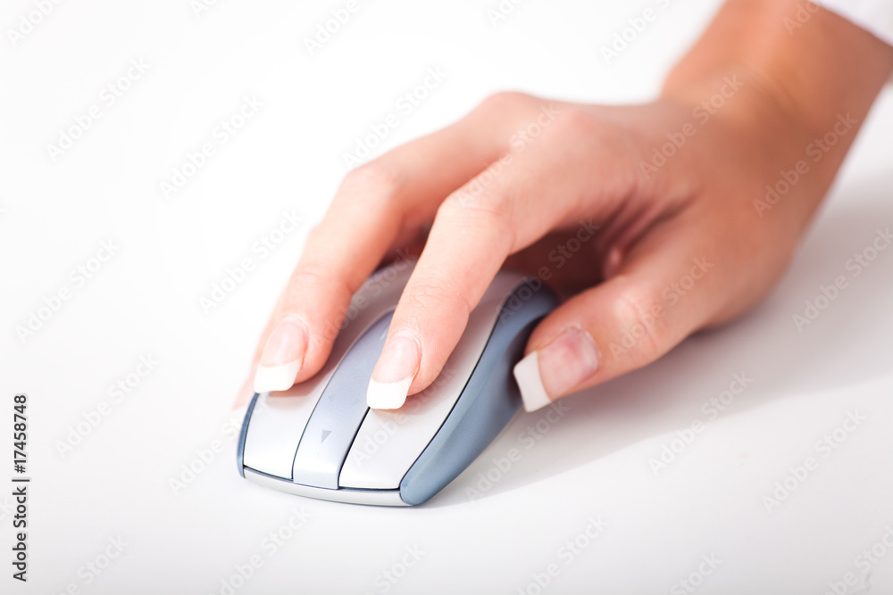 Womans hand and a computer mouse Womans hand and a computer mouse